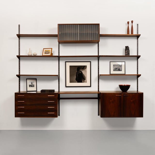 This exquisite vintage FM Reolsystem shelving system, designed by the renowned Danish designer Kai Kristiansen, is a true...