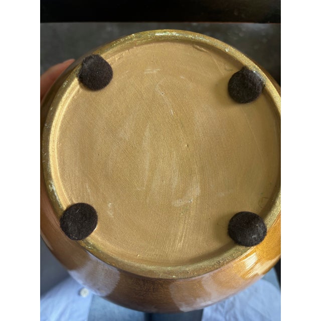 Arteriors gold pod vase. Black lacquered inside. Approximately 11 1/4" tall by 9 1/2" wide. Almost never used, in mint...