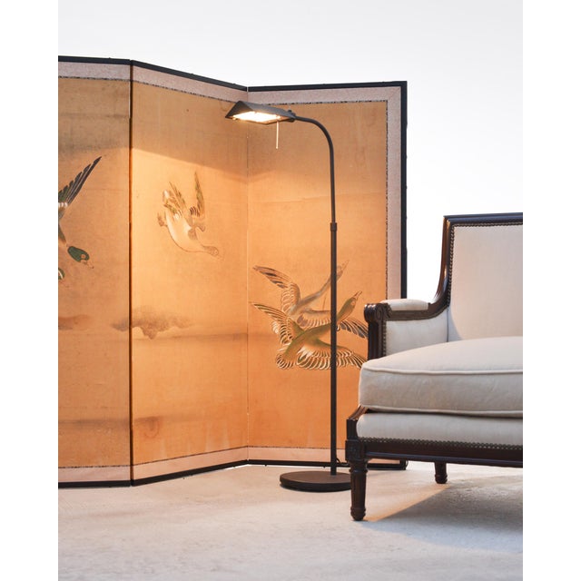 Serene late 19th century Japanese Meiji Period four-panel screen capturing ducks and geese mid-flight across a tranquil,...