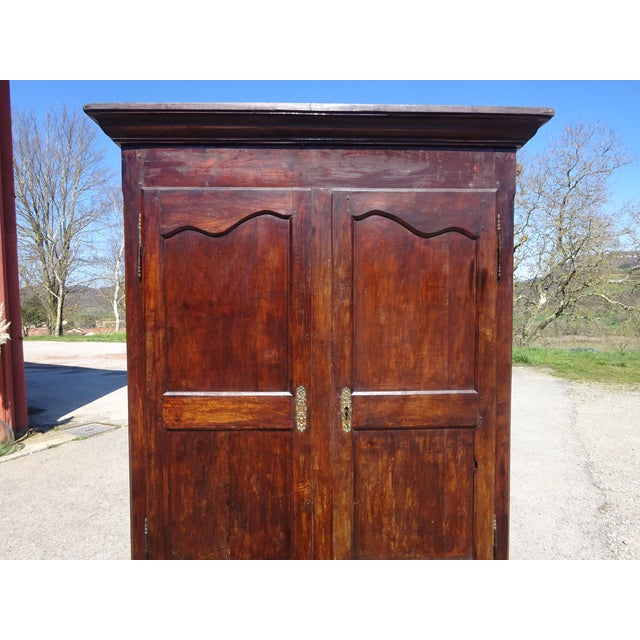 Beautiful, medium-sized Louis Philippe period wardrobe in solid walnut. Two large, paneled walnut doors with original...