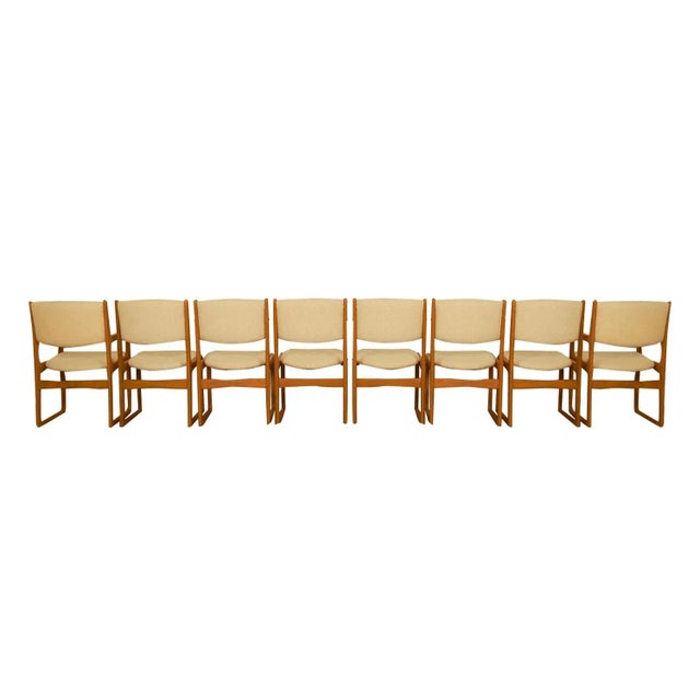 Set of eight beautifully sculpted Danish Modern teak-dining chairs designed by Benny Linden. Maker’s label under seat...