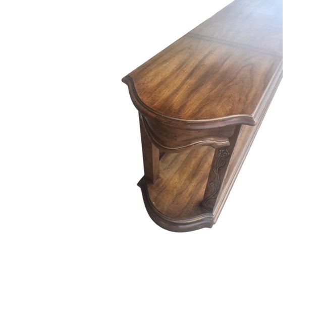 A substantial vintage console or sofa table by Heritage Furniture, dating to approximately the 1970s. Measuring an...