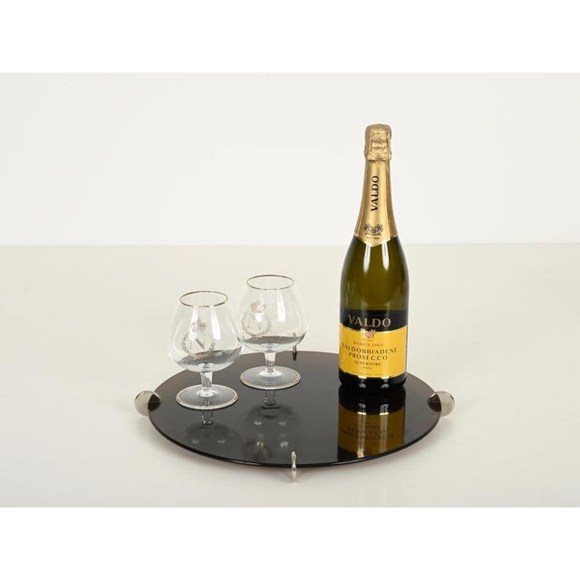 Elegant and unique Italian modern serving tray or centerpiece in smoked acrylic glass and chrome-plated metal. This...