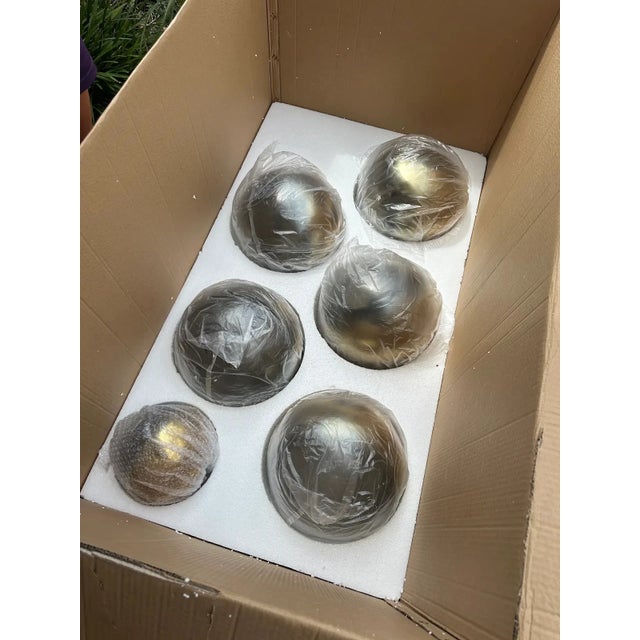 This Corbett Lighting Kyoto chandelier, features twelve brass-plated ombré glass globes arranged on a sculptural vintage...