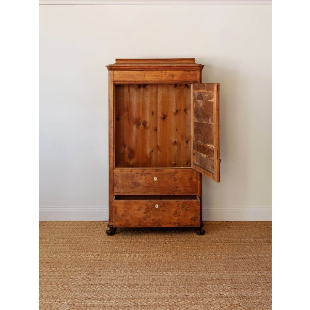 A refined example of the Biedermeier period's devotion to clean architectural lines and exceptional wood selection, this...