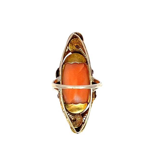 Discover the timeless elegance of our Coral Cameo Ring, crafted from luxurious 10k yellow gold. This exquisite piece...