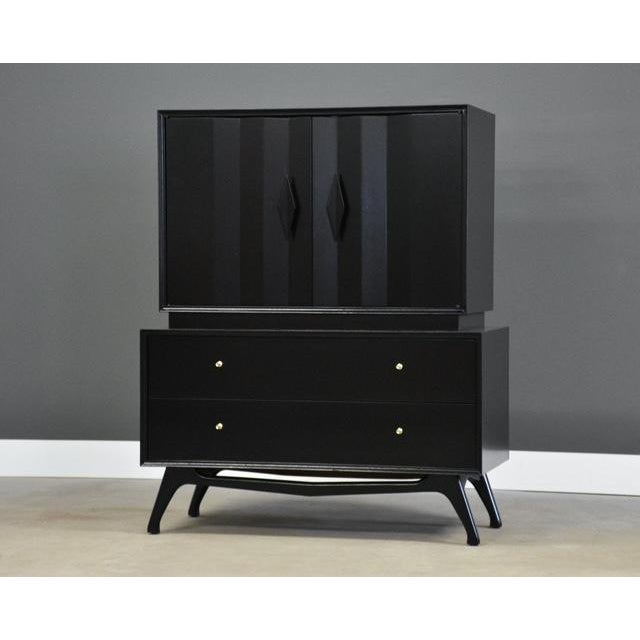 A mid century modern walnut tall dresser ebonized in black lacquer with diamond details and dovetail drawers. Circa...