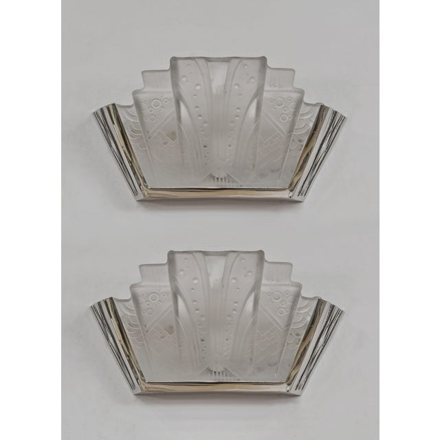 MULLER FRERES A pair of French art deco wall lights made around 1925-1935 in nickel plated solid brass or bronze holding...