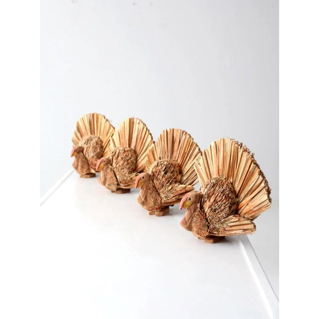 Gobble, gobble! Adorn your Thanksgiving tabletop with this set of four natural woven turkeys. The decorative turkeys...