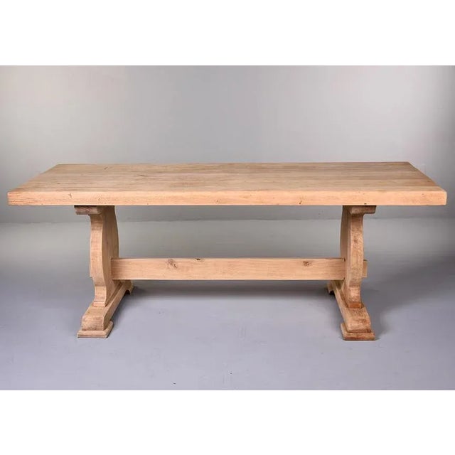 Found in France, this circa 1900 French oak farm trestle table has a bare finish and has been sanded smooth. Classic...