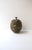 A hand‑thrown stoneware pottery vase, Organic Modern, circa mid to late-20th century (1960s-1970s), America. The vase...