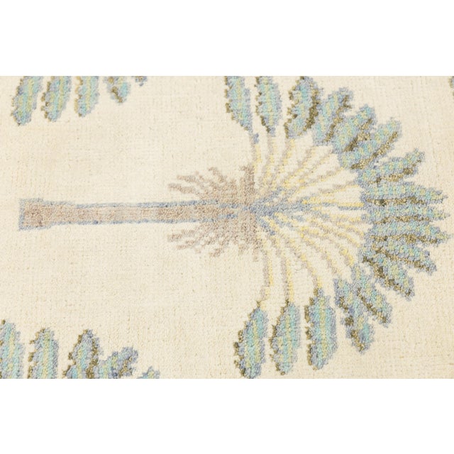Bring a touch of tropical sophistication to your space with this 4x6 modern Art Deco-style wool rug. Featuring a rhythmic,...