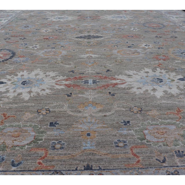 Measures: 9'0 x 12'4 Modern Oushak Rug with a Gentle Blend of Muted Greens and Florals 9'0 x 12'4. Country of Origin:...