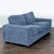 This modern 2-seat sofa features a stylish blue fabric and wide, square arms for a contemporary look. The plush cushions...