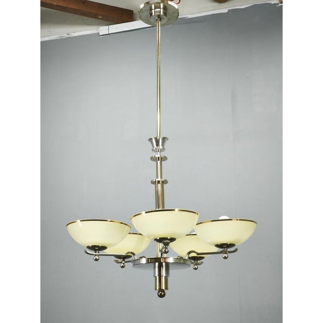 An elegant art deco chandelier produced in czechoslovakia during the 1930s, showcasing refined craftsmanship and timeless...