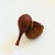 A mid century turned wood figurine in the shape of an Elephant. Adorable stylized features with suede ears and tail. Made...