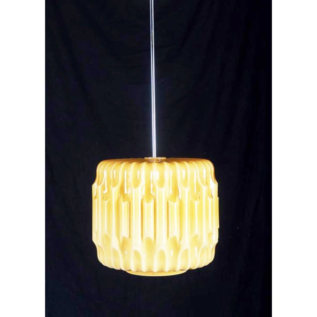 This double layered red and opaline glass pendant was made in the 1960s in Czechoslovakia. European Plug (up to 250V).The...