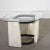 Rare 1960’s eye shaped side table featuring a plaster base with abstract carving details held together by iron with a...