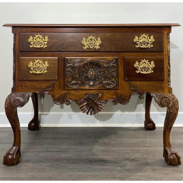 Kindel Winterthur Collection clawfoot mahogany Philadelphia lowboy. Features mahogany, ball & claw feet, fine carved...