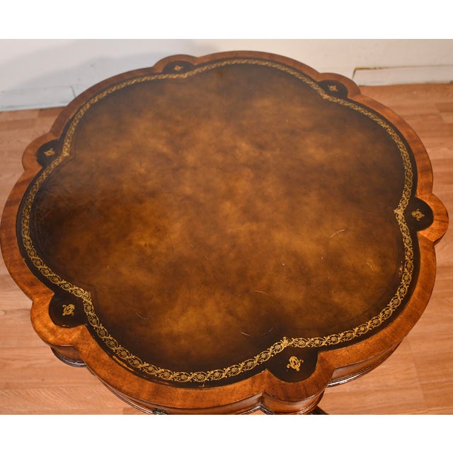 We are pleased to offer this Beautiful English Regency center table by Weiman, from the 1930s . This table is made of...
