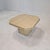 Very nice Italian coffee or side table handcrafted out of travertine, 1980s. The top is rounded on the edge. It is made of...