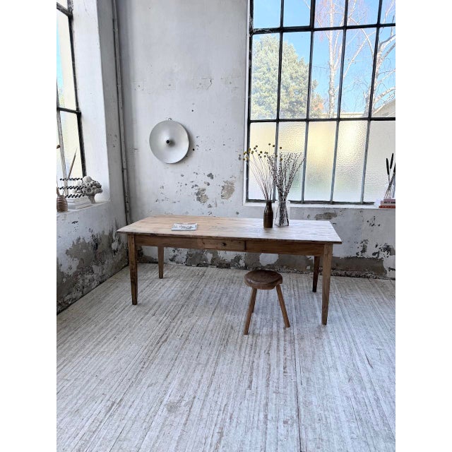 Vintage small pine farmhouse table from the 1950s. We love its typical farmhouse look, with its tapered legs, patinated...