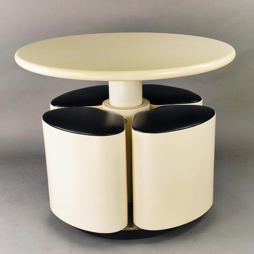 Incredible Space-Age set lacquered in cream white. It presents itself as a round flower-shaped coffee table, which, with...