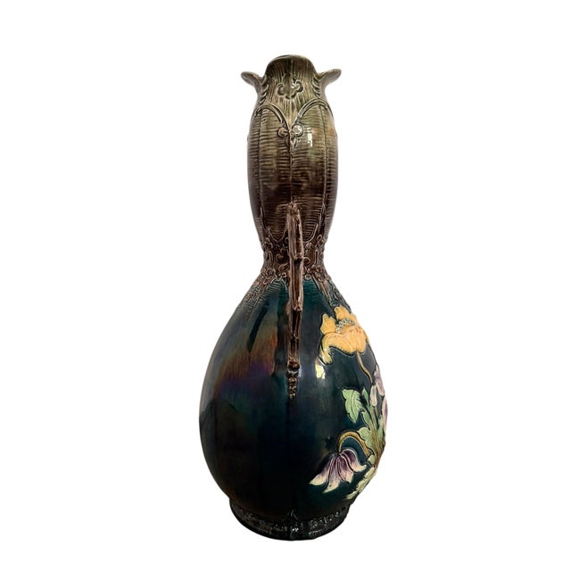 9 1/2”W x 18”H x 8”D This exquisite early 20th-century French Art Nouveau vase exemplifies the Barbotine majolica...