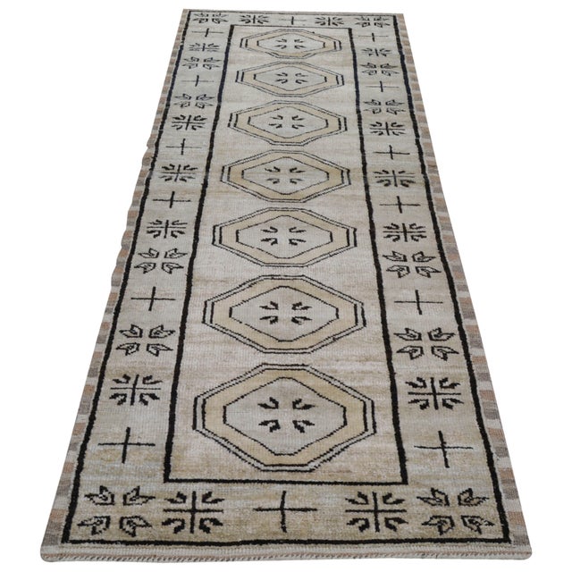 Hand-knotted with care using traditional rug making techniques, this wool rug blends timeless craftsmanship with a modern...