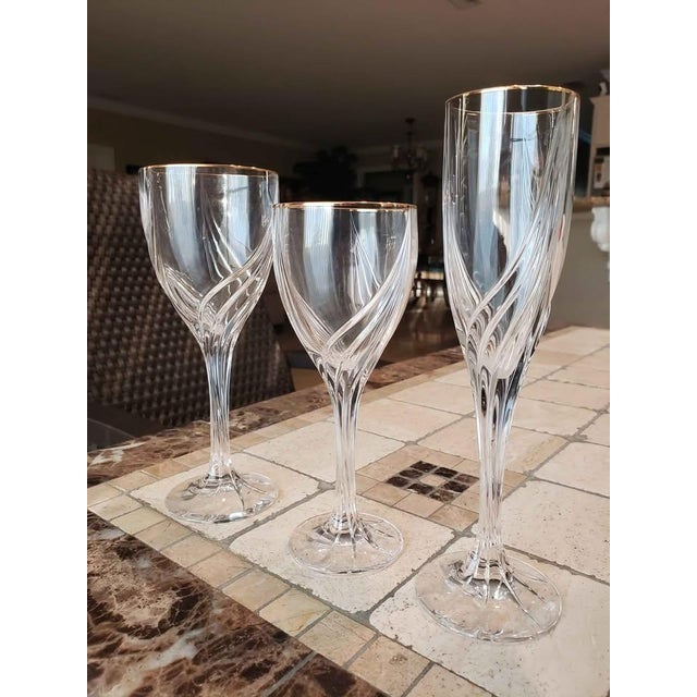 14 pieces of Lenox Gold Debut crystal. All of these pieces are either new and have never been used or they were used no...