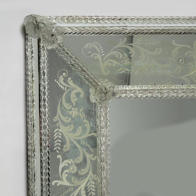 Impressive antique Italian wall mirror featuring reverse etched panels with classic floral designs inside hand blown...