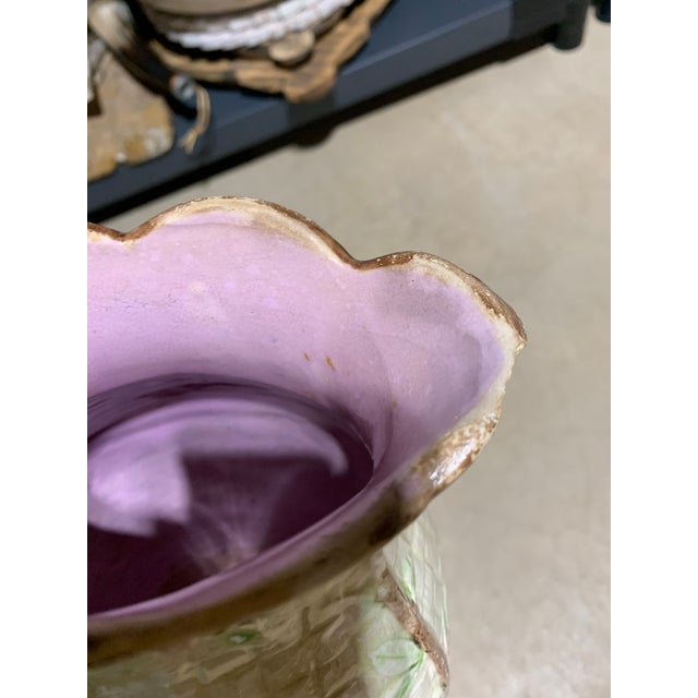 This item is a vintage Majolica pottery pitcher, likely crafted by Thomas Forester & Sons, featuring a detailed bird and...