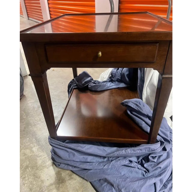 This Woodbridge Furniture Marseilles Side/End Table is a brand-new, never-used showroom display piece that exudes timeless...