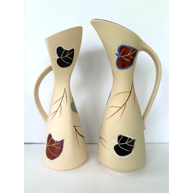 These are two West German pottery vases, likely from the mid-20th century, made by Dumler & Breiden. This company, located...