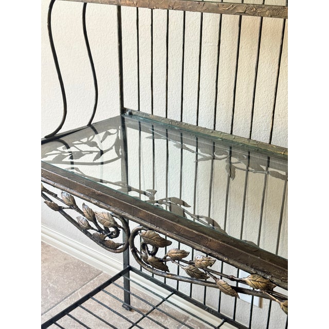 Elegant wrought iron baker’s rack attributed to Hooker Furniture, featuring a beautifully detailed hand-forged style frame...