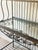 Elegant wrought iron baker’s rack attributed to Hooker Furniture, featuring a beautifully detailed hand-forged style frame...