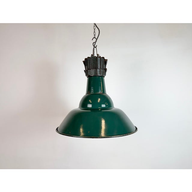 Industrial petrol (green) enamel factory pendant light made by sammode in france during the 1950s. White enamel inside the...