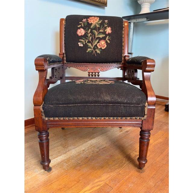 A late Victorian period armchair featuring an emphasis on geometric lines rather than heavy curves. The chair features...