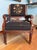 A late Victorian period armchair featuring an emphasis on geometric lines rather than heavy curves. The chair features...