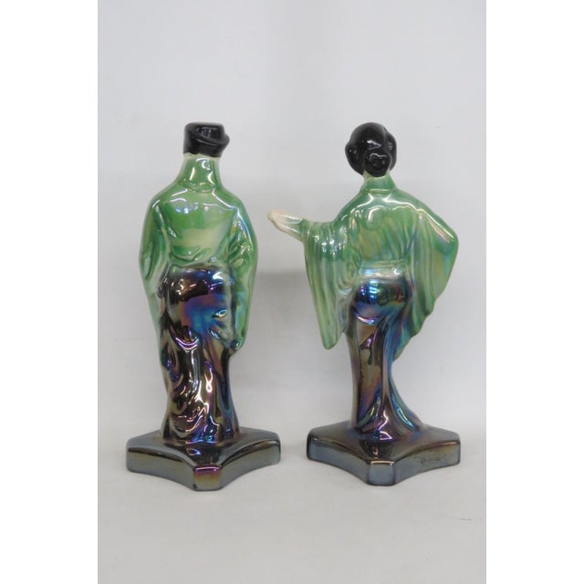 This gorgeous Pair of 2 Figures / Statues is made of ceramic. These figures present a gorgeous eosin-glazed finish...