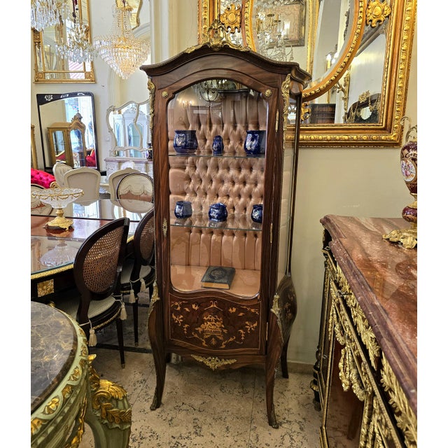 Make a statement with this grand French-style display vitrine, crafted with a richly finished wood cabinet and an elegant...