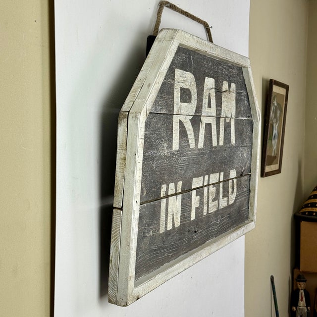 A gorgeous late 20th Century wooden sign highlighting 'Ram In Field". Most likely came out of a farm and explains its very...