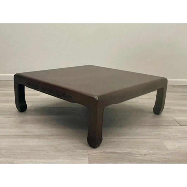 Sophisticated and elegant elm Chinese coffee table having handsome carvings on all sides and beautiful Asian style legs...