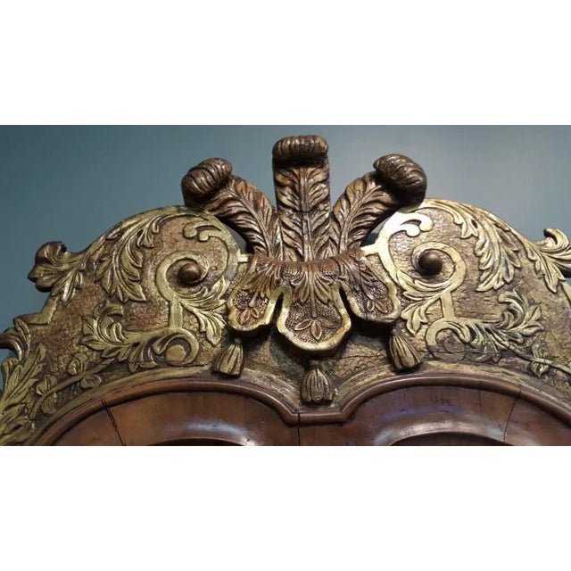 Antique 18th c. English walnut pier mirror with gilt Prince of Wales pediment. Measures 22 1/2" wide x 46" high. Shaped...