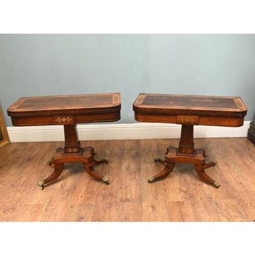 Pair of elegant period Regency mahogany card tables of refined classical design Circa 1810 Each table features a hinged,...