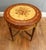 French Louis XVI Revival marquetry occasional table in fruitwood with ormolu mounts Elegant circular top featuring a...