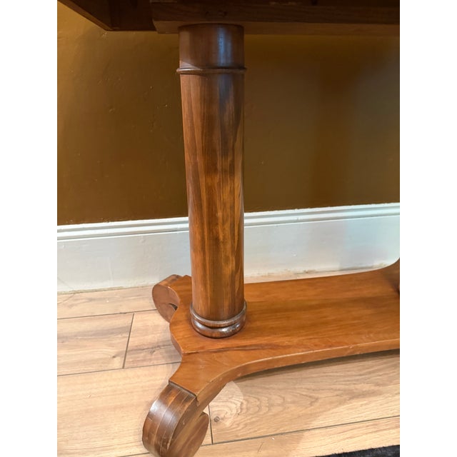 Add a sense of historic permanence to your home with this exceptional Antique American Empire library table crafted from...