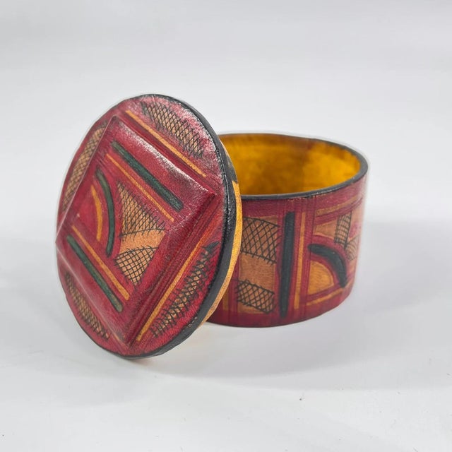 Beautiful Round Wooden box covered in embossed leather and patterns.The Tuareg people, known as the "Blue People" for...