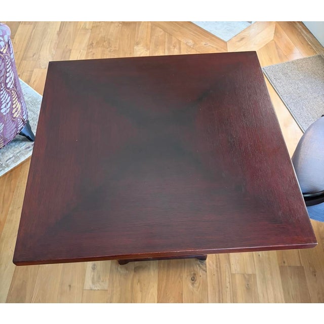 Family room 36”x36”x30”H Donghia red mahogany wood game table. Purchased 04/24/2002. Note: Table is not marked. See...