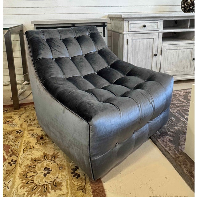 A pair of Thayer Coggin Scoup Chairs, upholstered in velvety soft gunmetal fabric, resting on recessed castors.